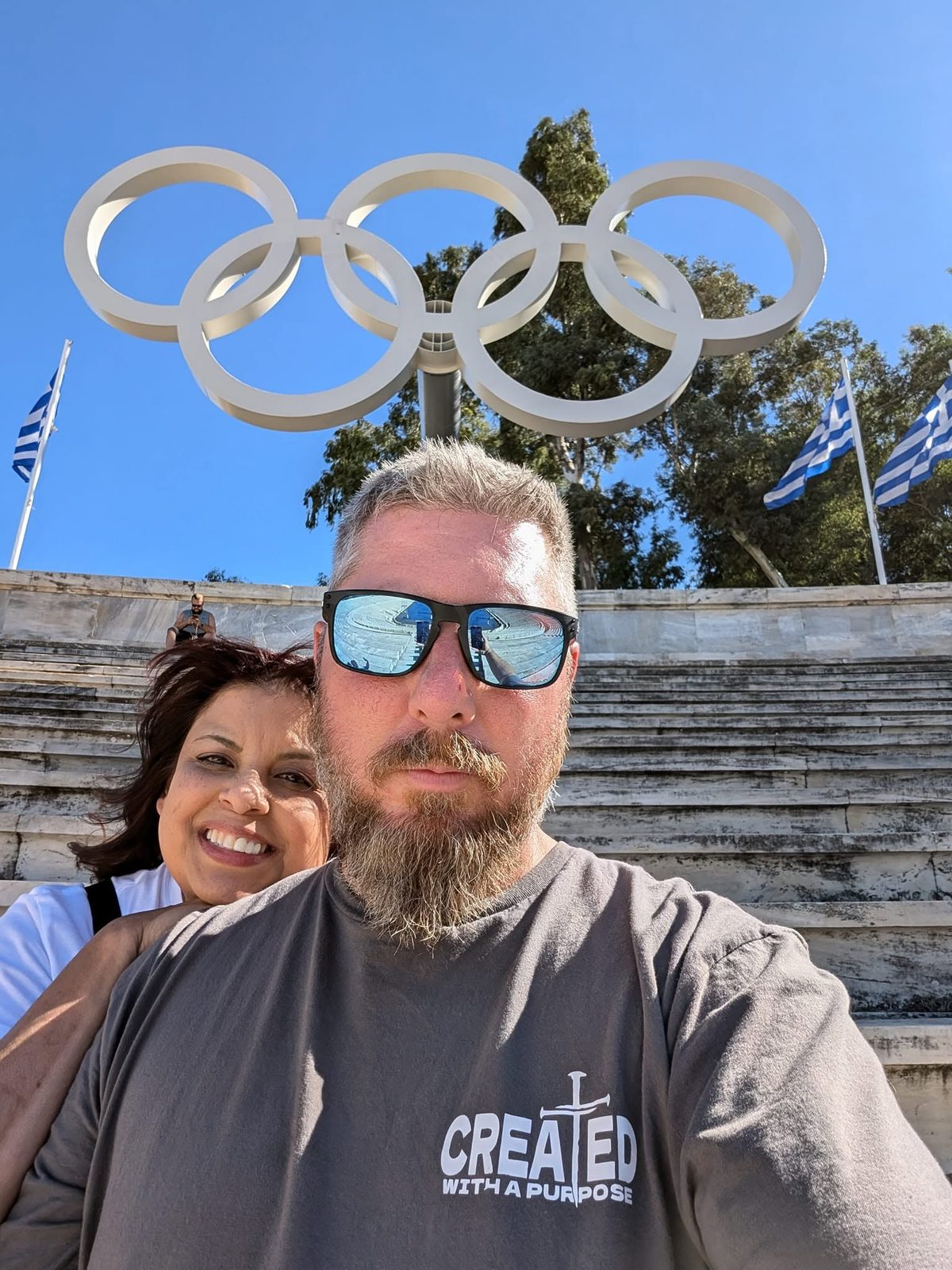 Larence and Ruthy under the Olympic Rings in Athens