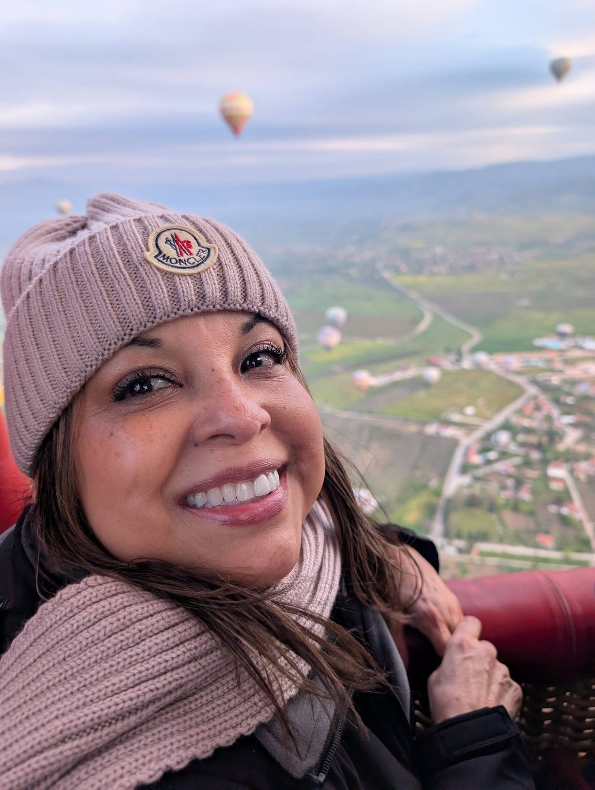Ruthy smiling during a hot air balloon ride over Cappadocia