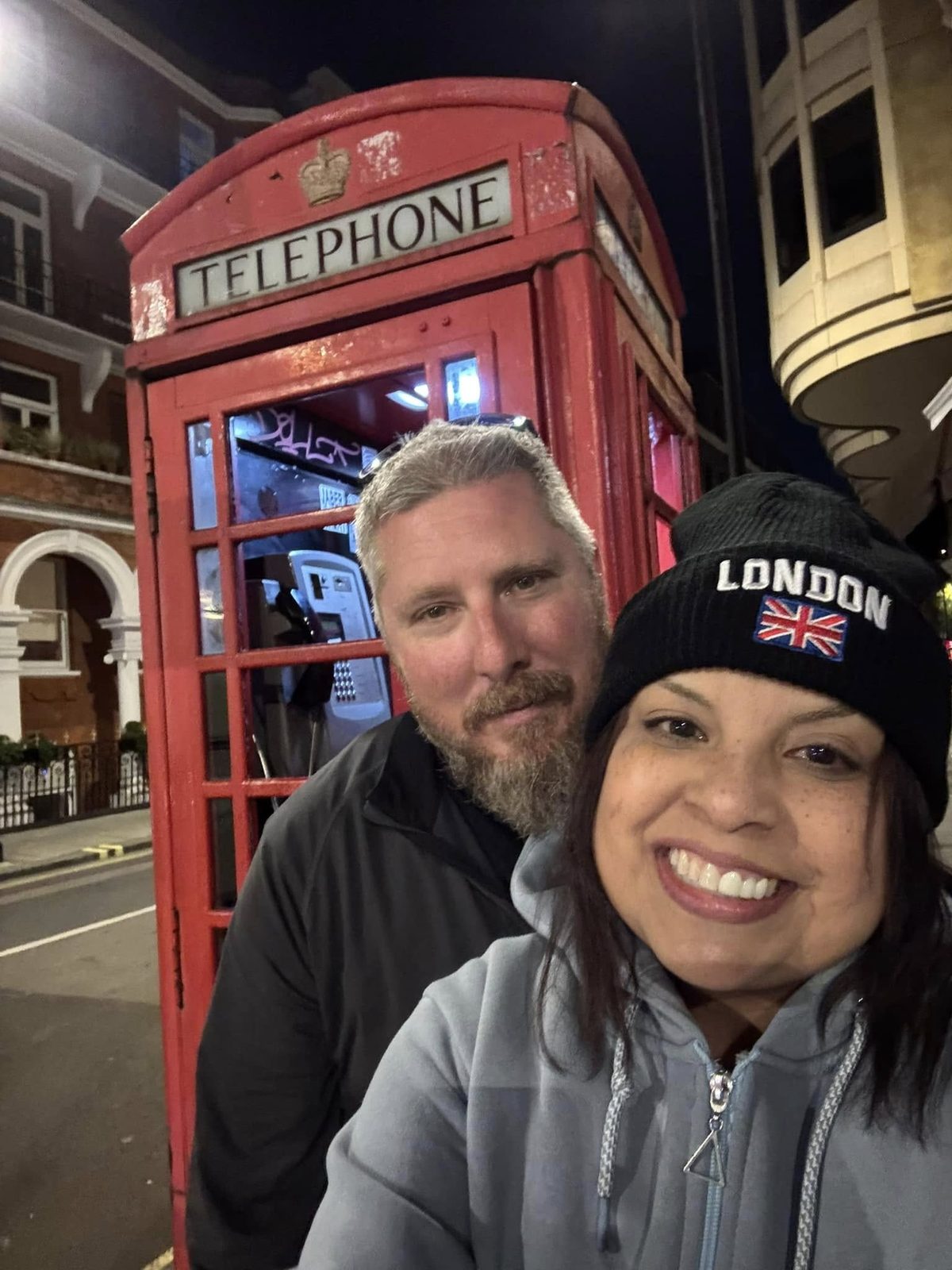 Larence and Ruthy by a red telephone booth in London
