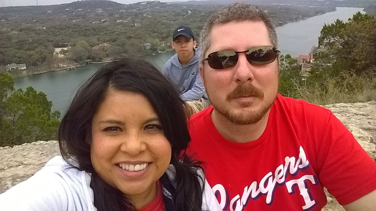 Family overlooking the river from Mount Bonnell in Austin, Texas
